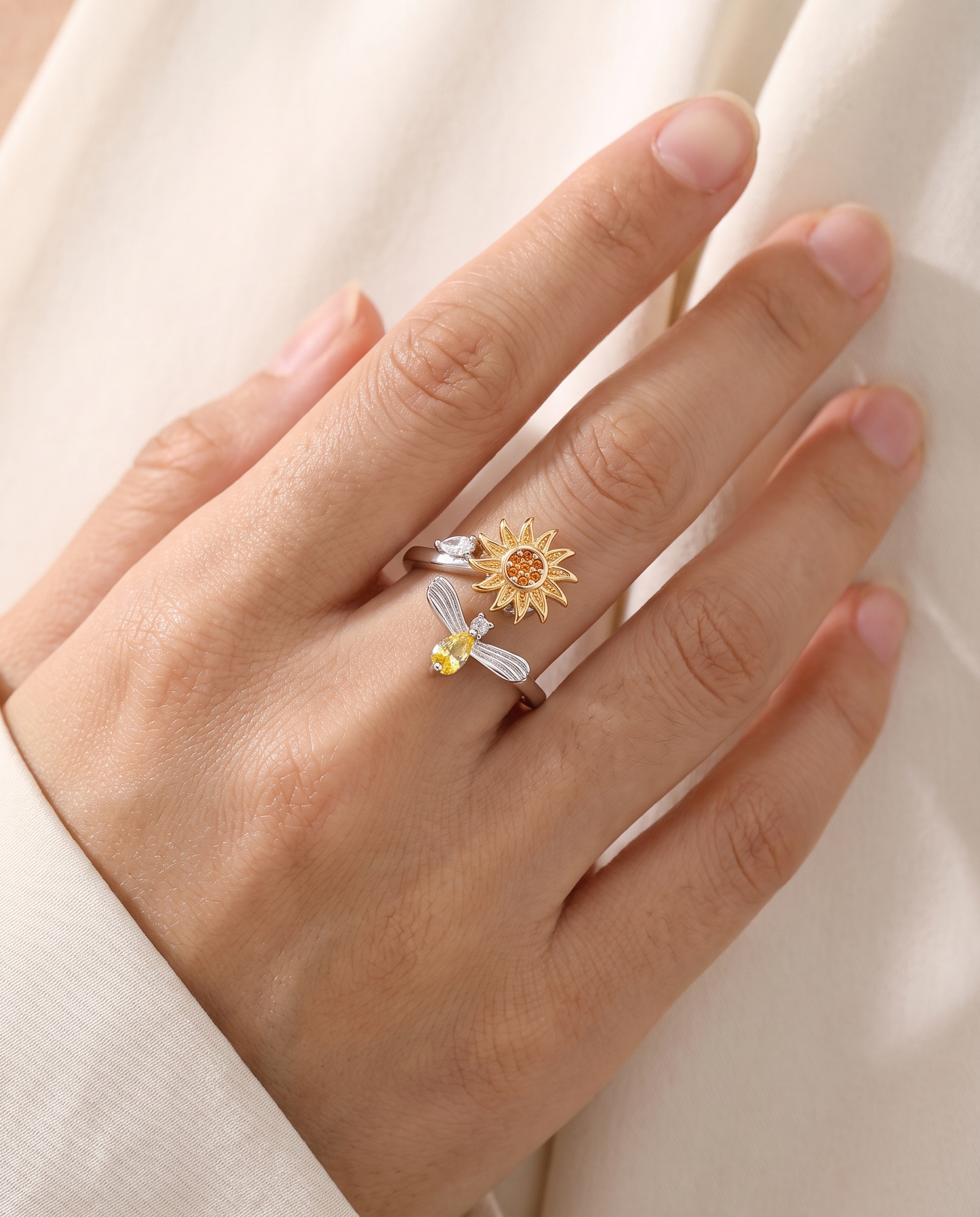 Seren sunflower spinner ring worn on finger