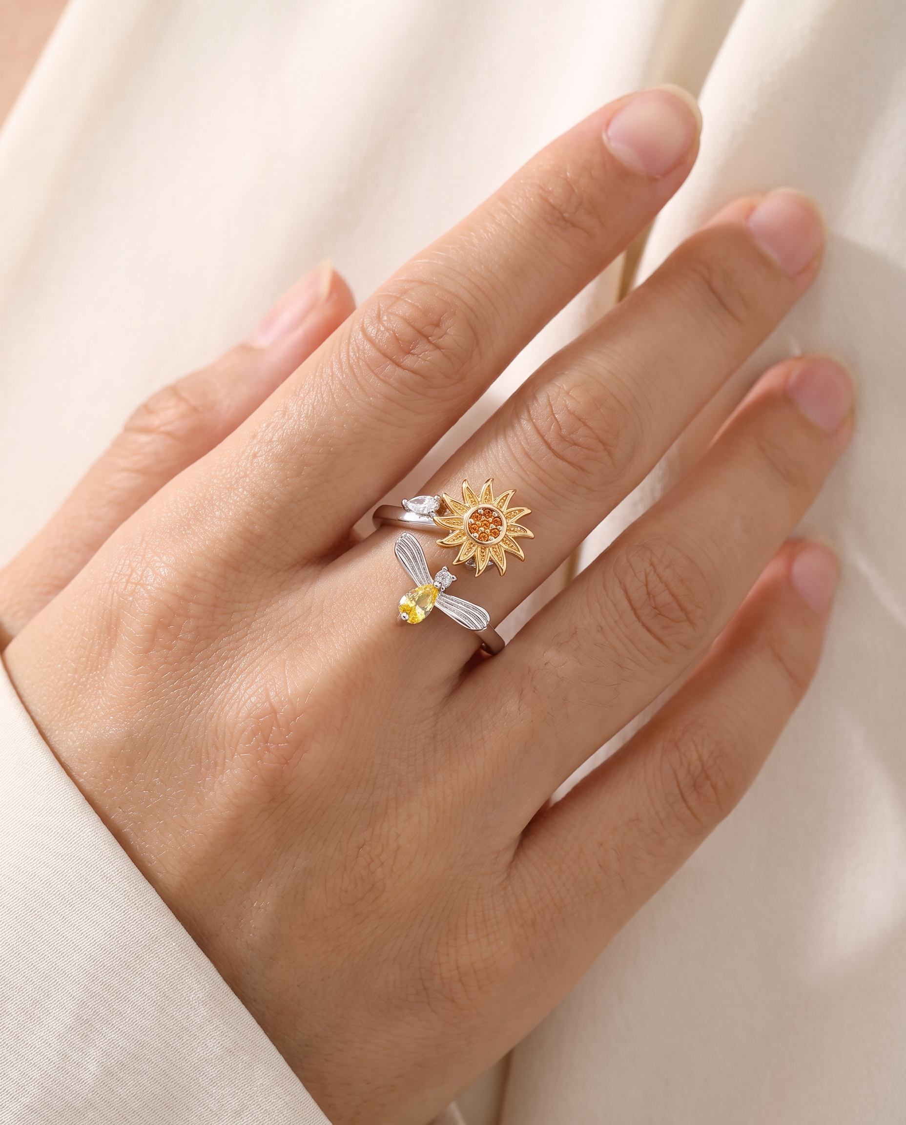 Seren sunflower spinner ring worn on finger
